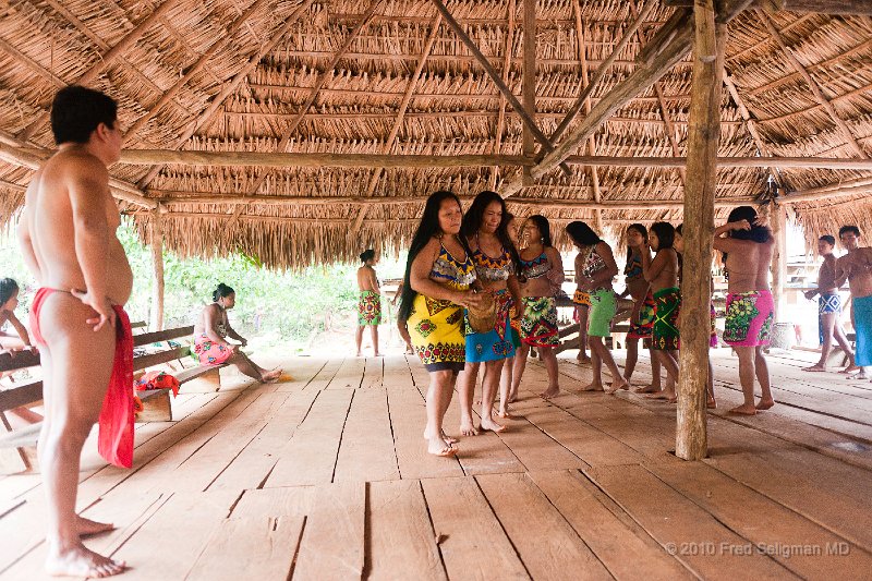 20101203_122440 D3.jpg - Tribal chief overseeing the young women who are  performing ritual dances
